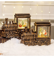 НЕТУ Новогодний снежный светильник-декор LED "Паровоз" (HC-D013) (8 рождест. треков, USB-кабель, Батар. AA*3, 24,4x8,5x18,5см) // [309] (6 шт/ящ)